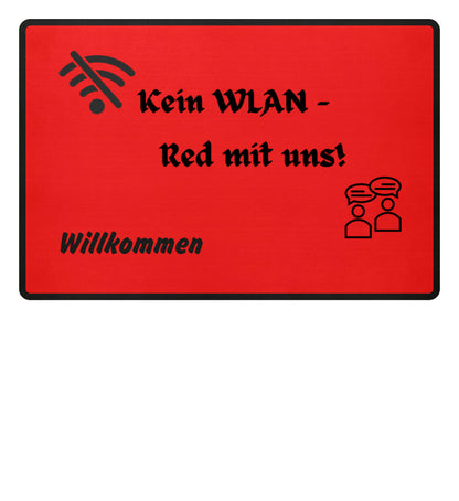 Rubin Red-Detailaufnahme der Fußmatte mit dem Spruch „Kein WLAN – Red mit uns“
